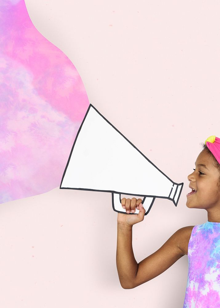 African kid holding paper megaphone on pink background