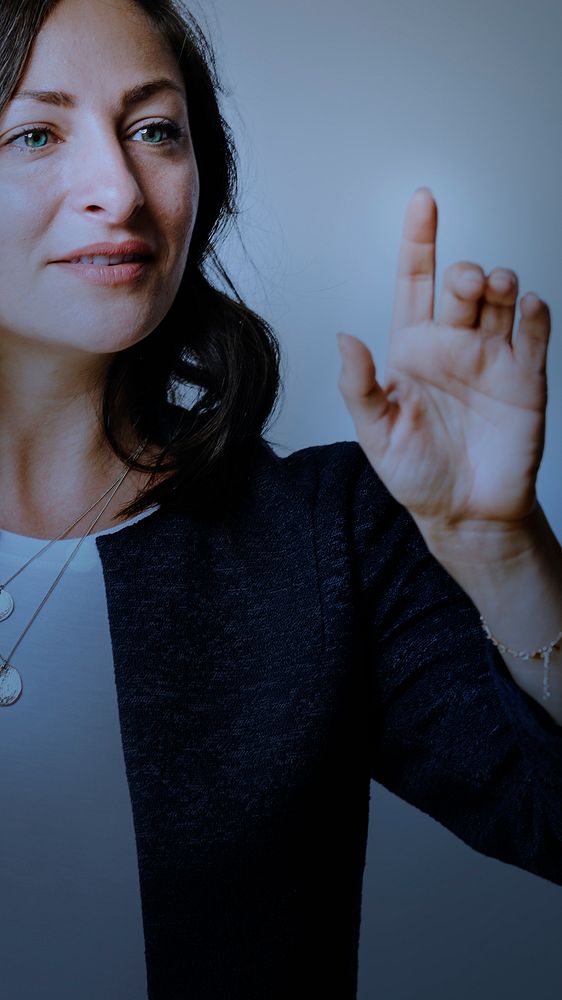 Senior businesswoman pointing on invisible digital screen