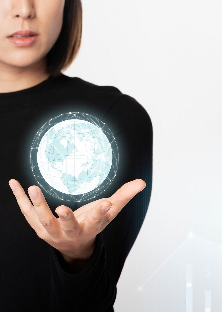 Businesswoman holding a digitally generated world