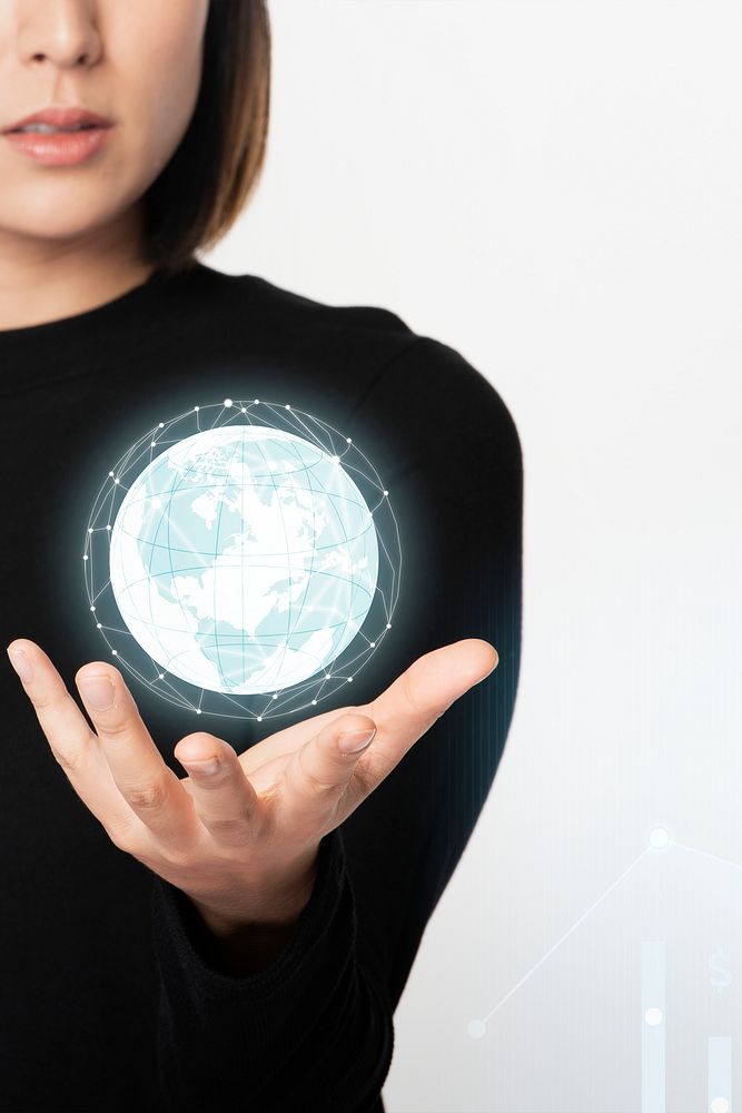 Businesswoman holding a digitally generated earth