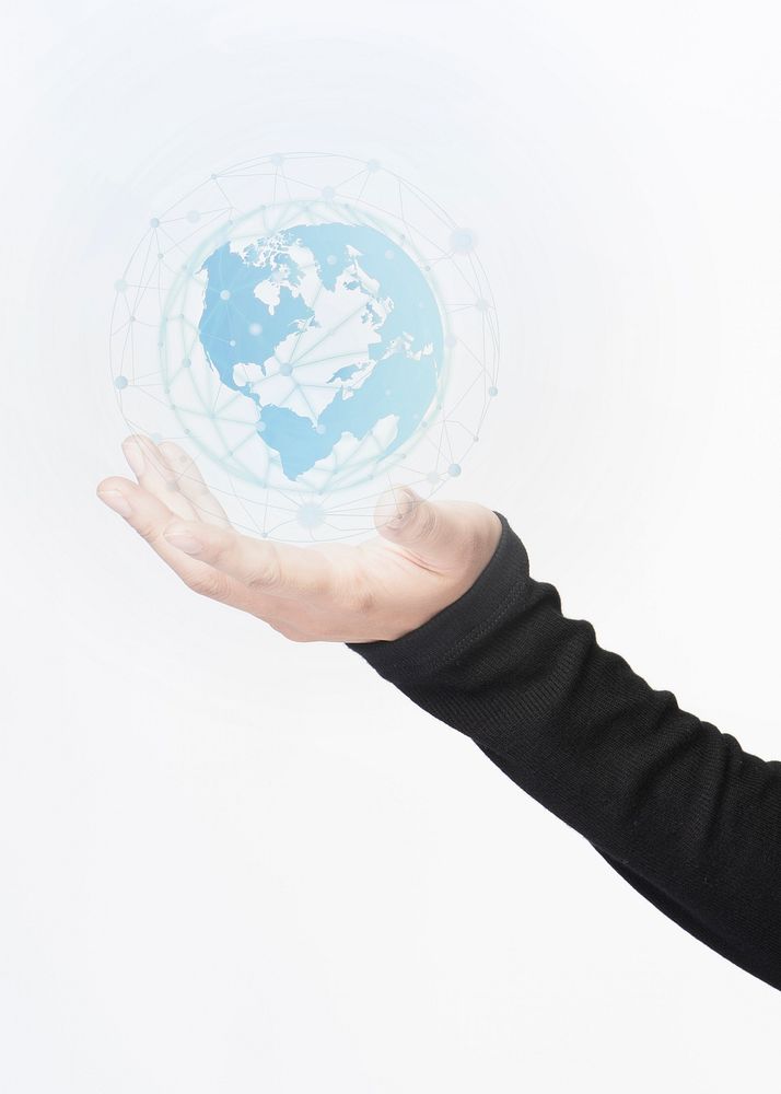 Business person holding a digitally generated globe