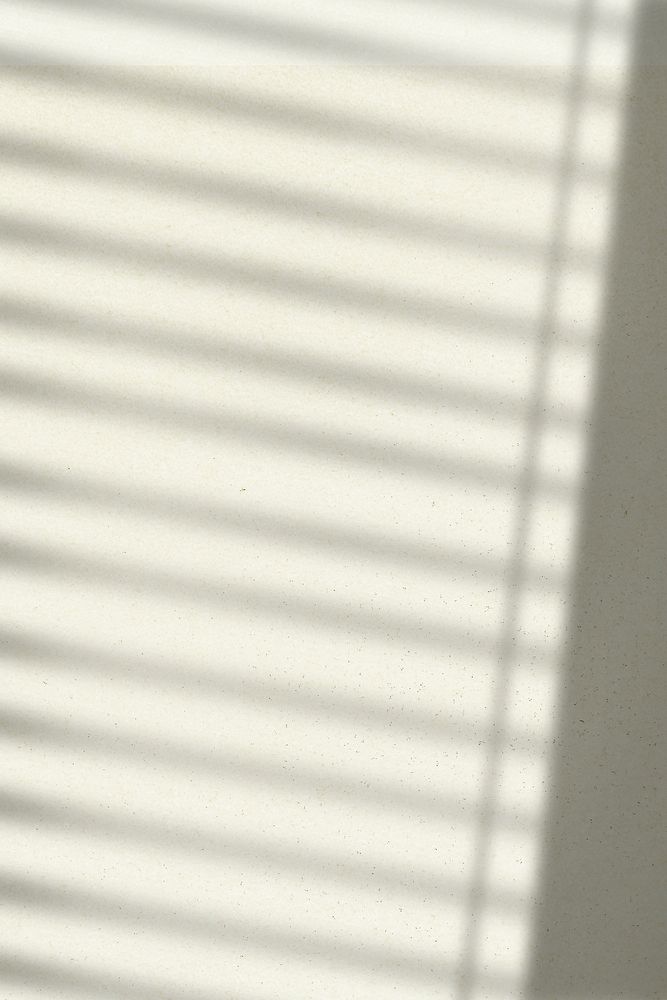 Background with window blind shadow during golden hour
