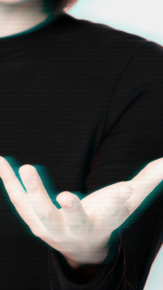 Glitching woman&rsquo;s hand background showing invisible object gesture digital remix