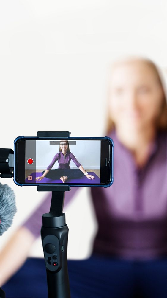 Woman blogger streaming an online yoga class