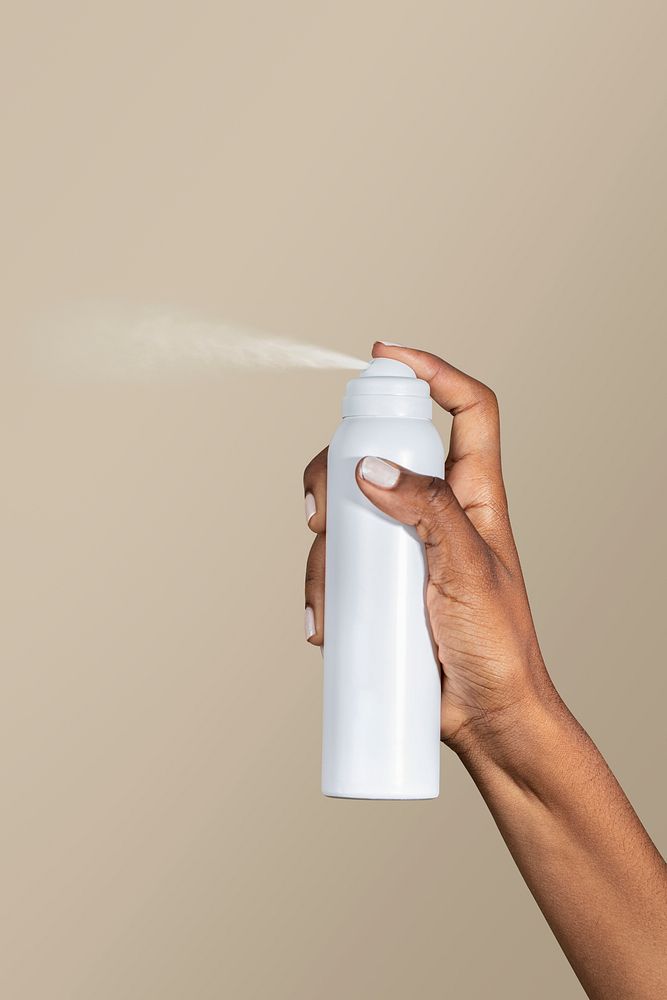 Black woman using a spray bottle psd