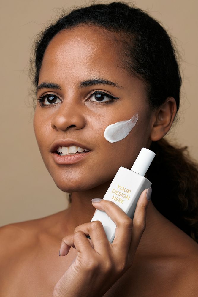 Beautiful African American woman holding a facial cream container mockup