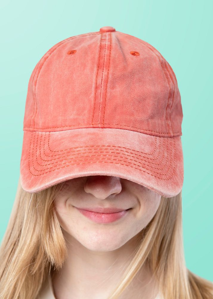 Happy woman wearing a red cap