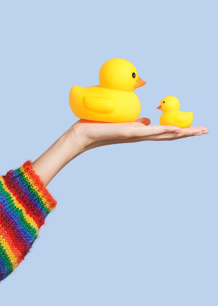 Cute rubber ducks on a hand