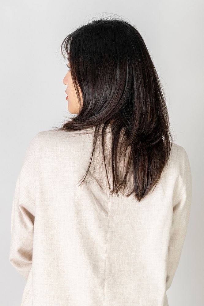 Rear view of a young woman wearing white shirt
