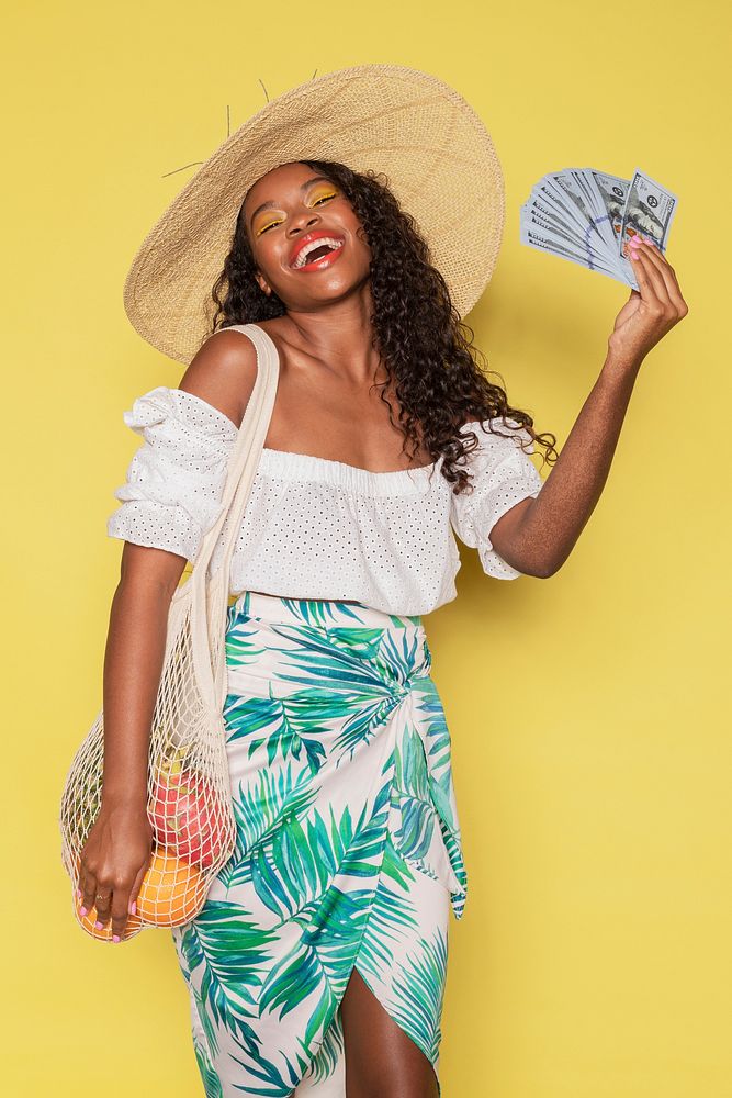 Happy woman spending money during her summer vacation  