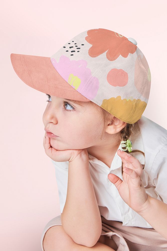 Girl wearing floral pattern cap in studio