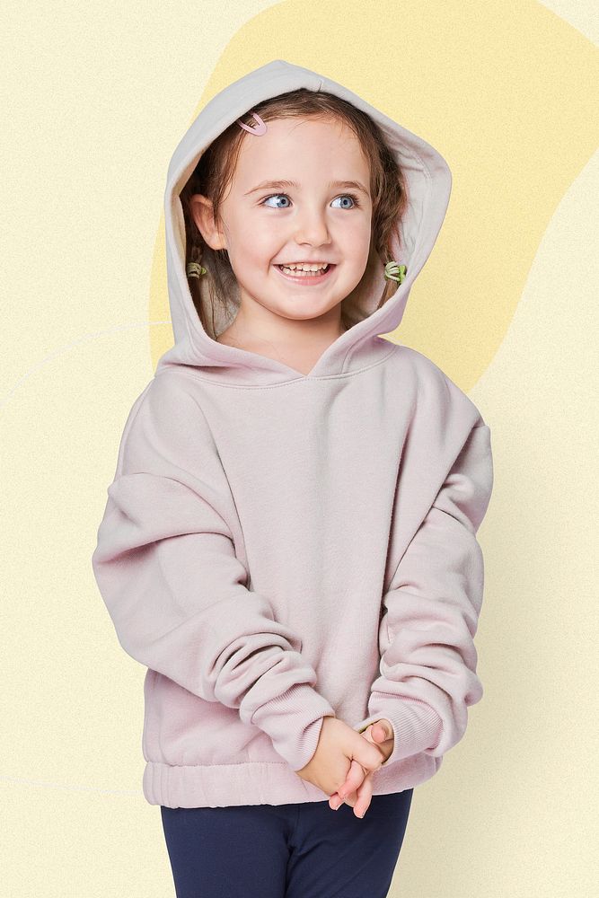 Little cute girl in a beige hoodie