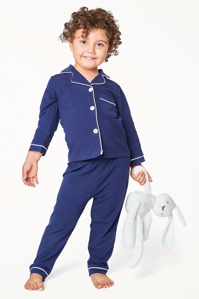 Girl in blue pajamas with a plush bunny