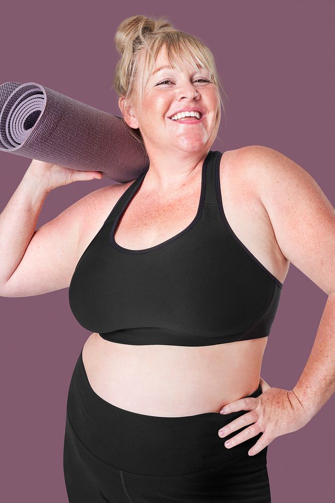 Body positivity curvy woman sportswear with yoga mat