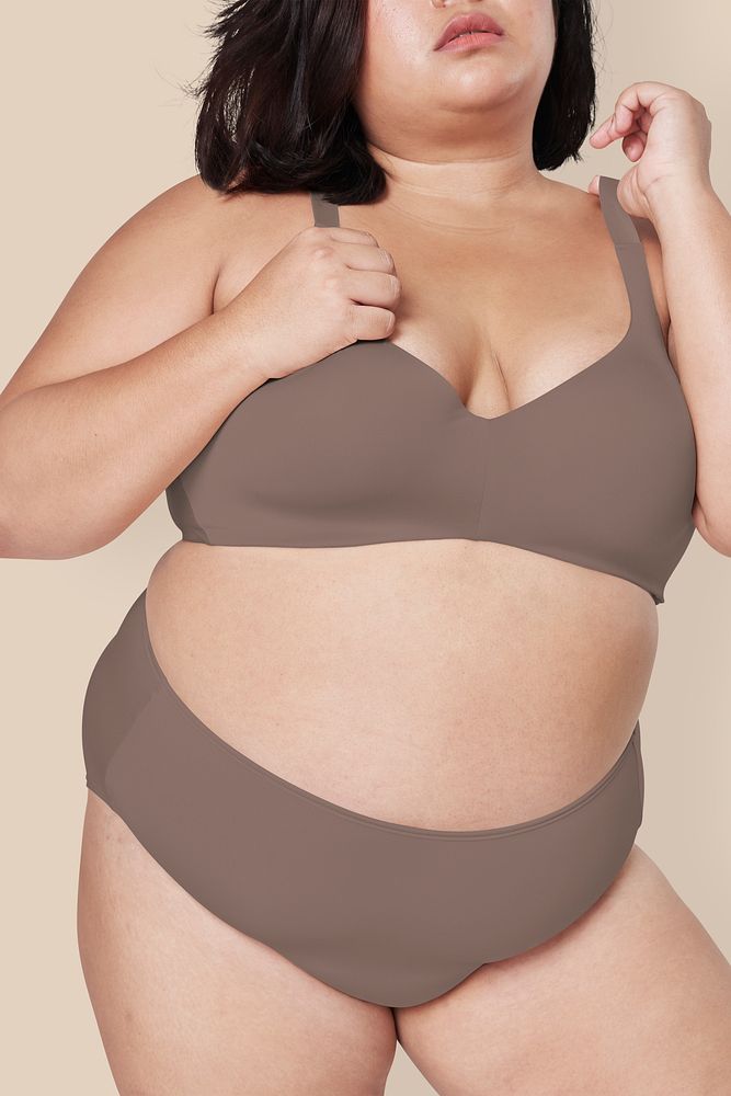 Body positivity brown lingerie plus size model posing