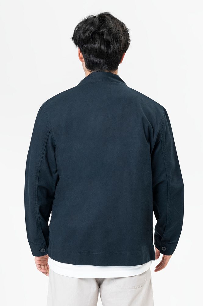 Man in navy jacket and shorts streetwear rear view