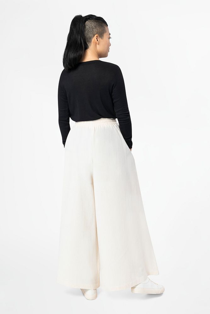 Asian woman in white palazzo pants with design space casual wear fashion rear view