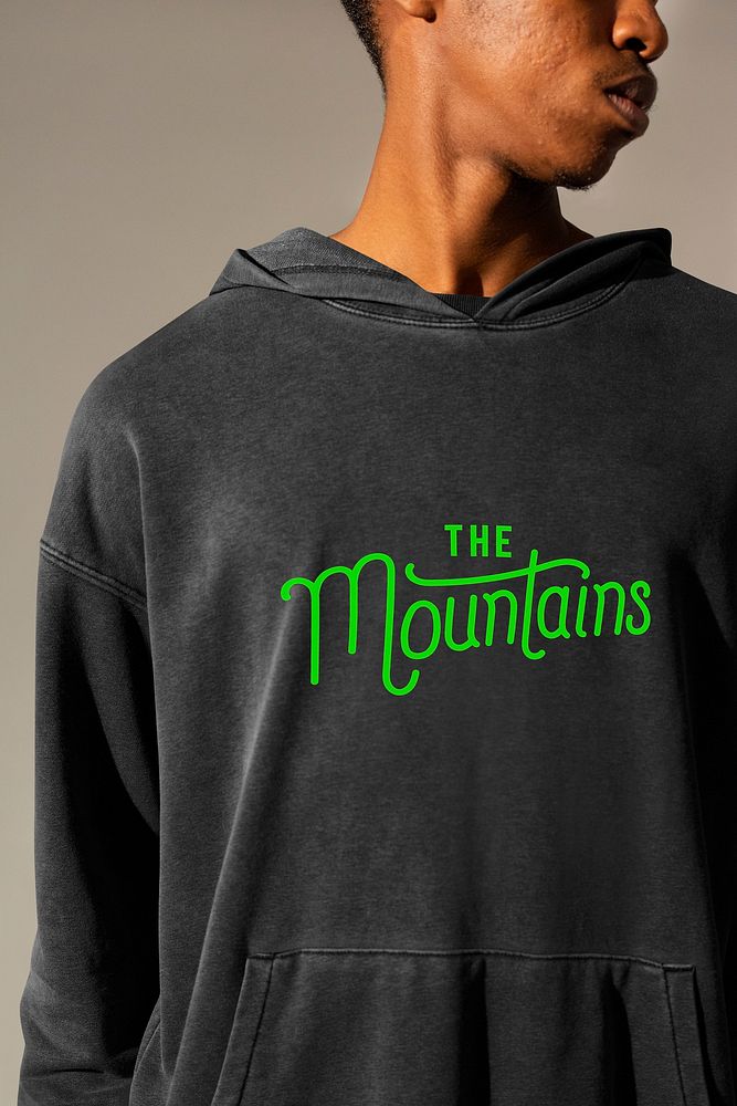 African American man wearing &lsquo;The Mountains&rsquo; printed hoodie close up