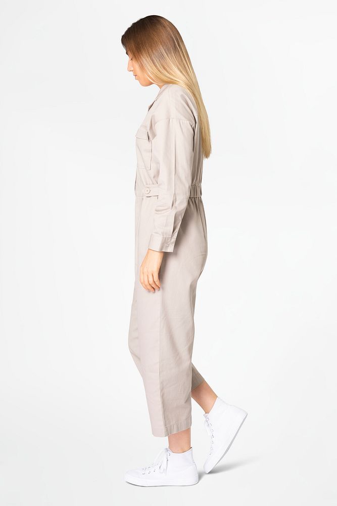 Blonde woman in beige jumpsuit with design space streetwear apparel full body