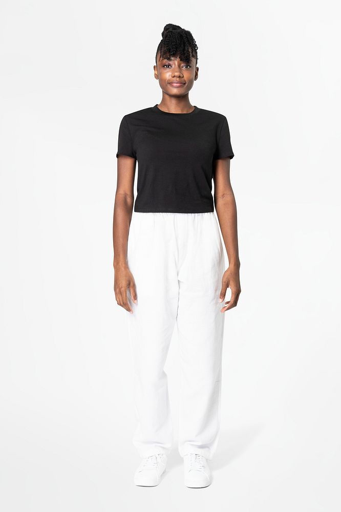 Woman in white sweatpants and black tee street apparel