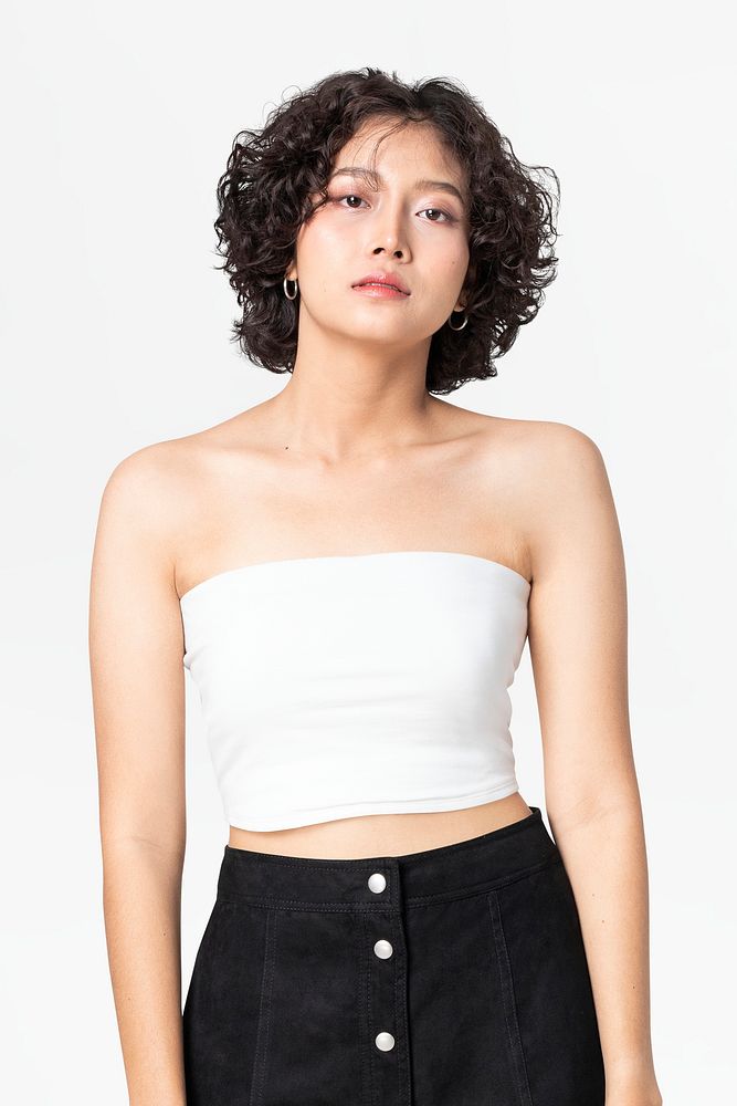 Woman in white bandeau top and black a-line skirt
