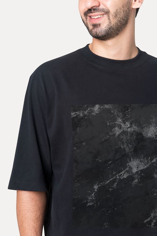 Man wearing abstract printed t-shirt studio portrait
