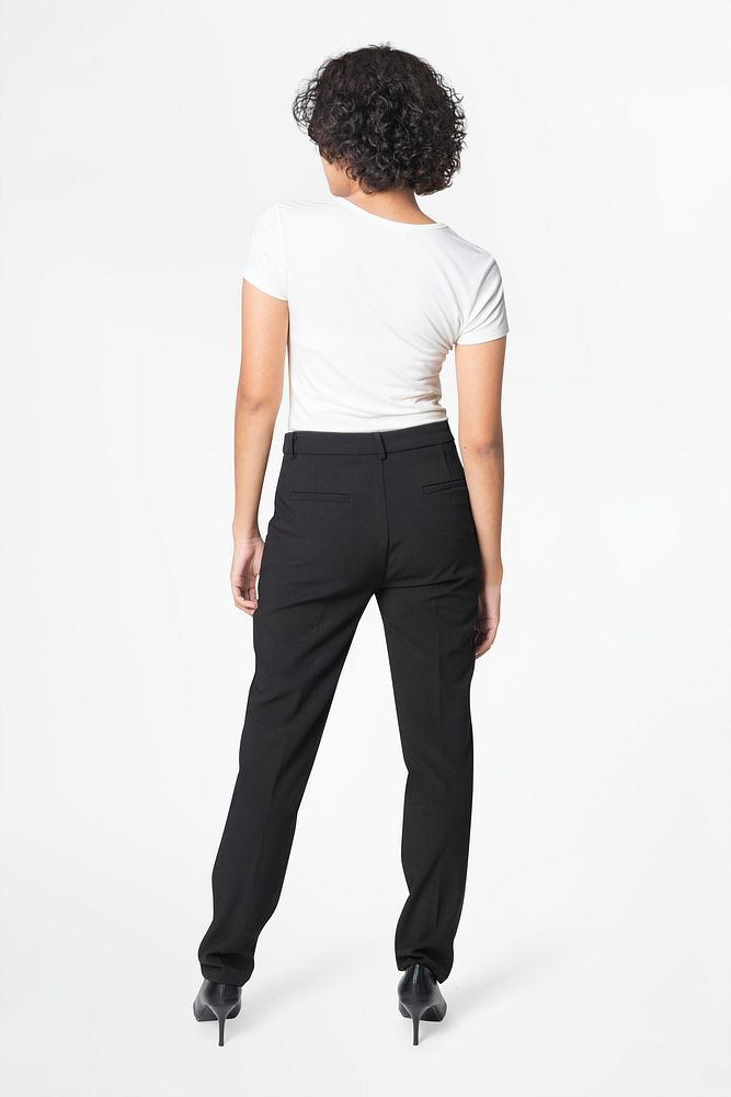 Woman in black slack pants and white tee rear view