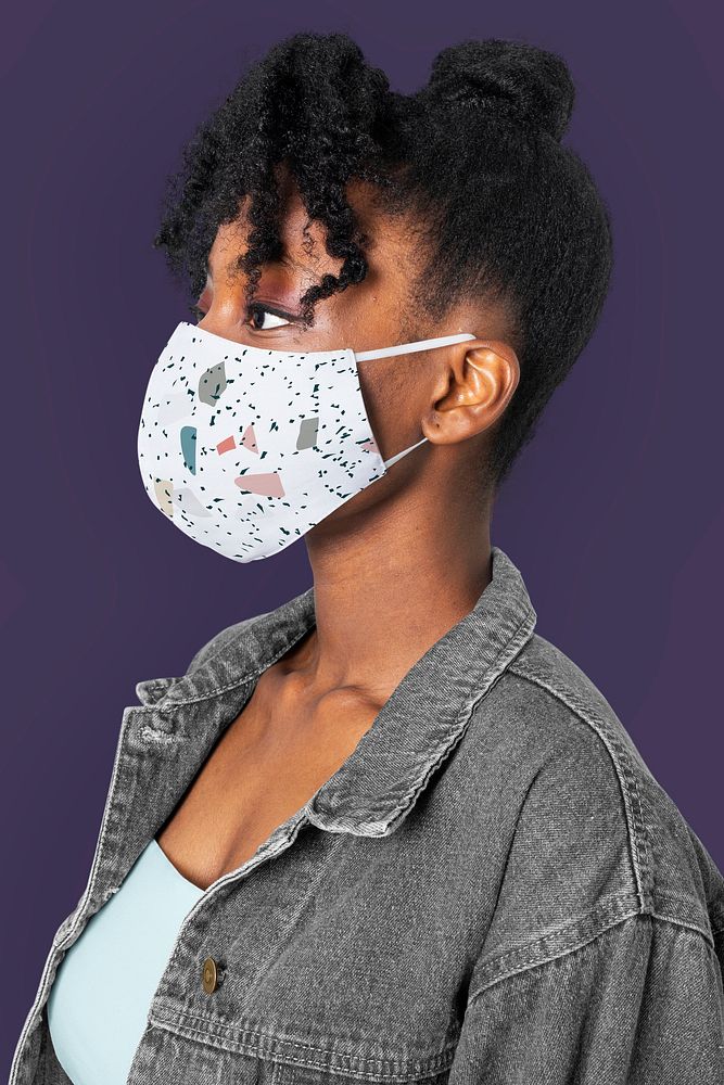 Woman wearing abstract design mask candid portrait