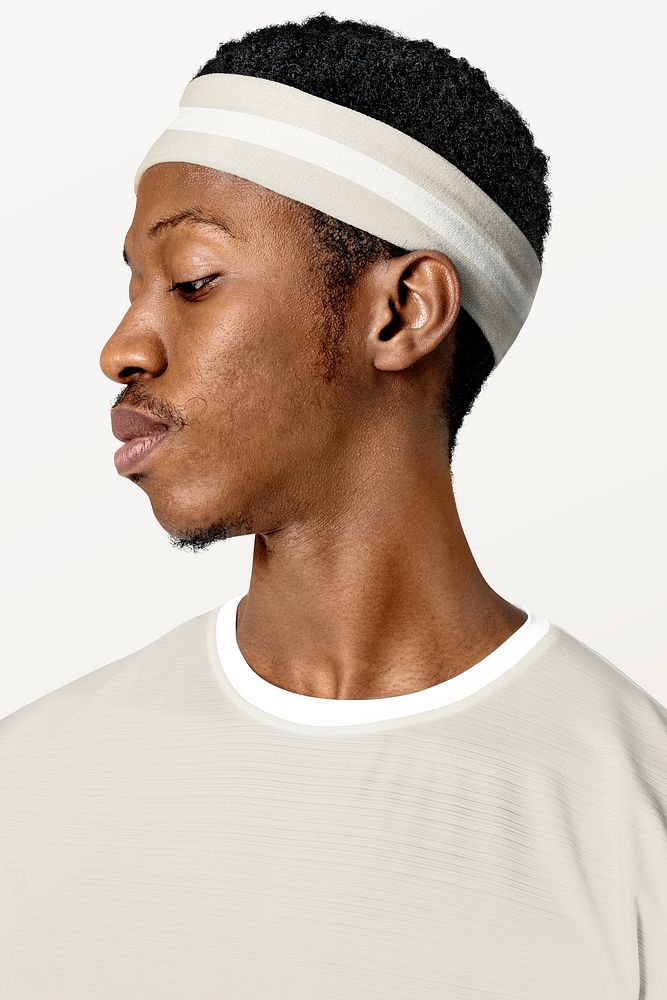 Sporty man wearing headband close up portrait studio shoot