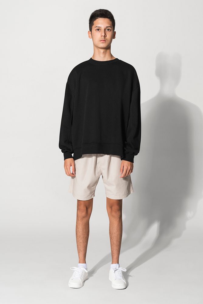 Teenage boy in black sweater winter apparel portrait