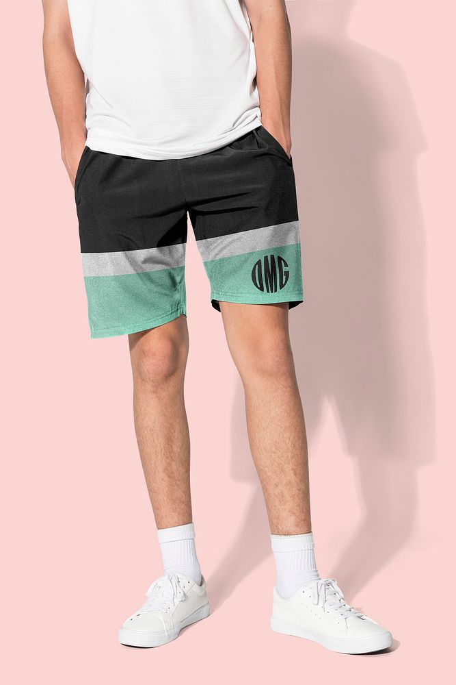 Man in black and green shorts with OMG graphics for summer apparel shoot