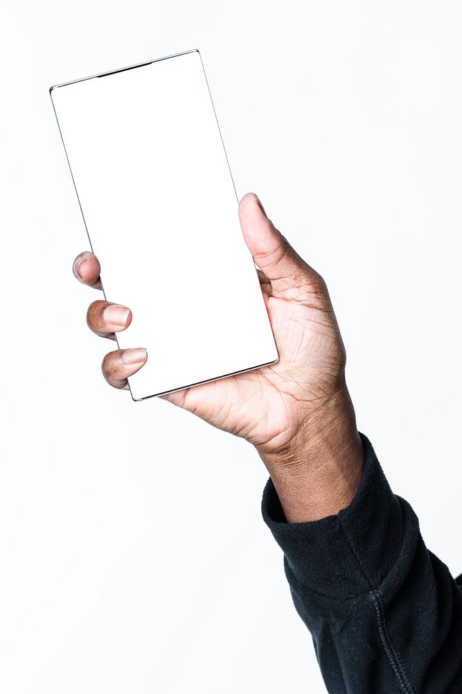 Hand holding a smartphone with a blank screen