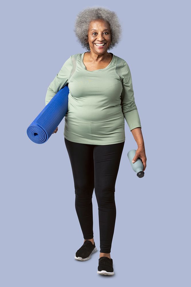 Happy black senior woman with a yoga mat and a water bottle mockup 