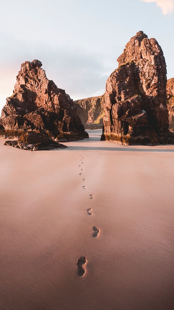 Beautiful beach scenery with footprints in the sand