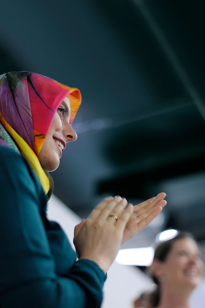Ambassador arabian woman clapping her hands