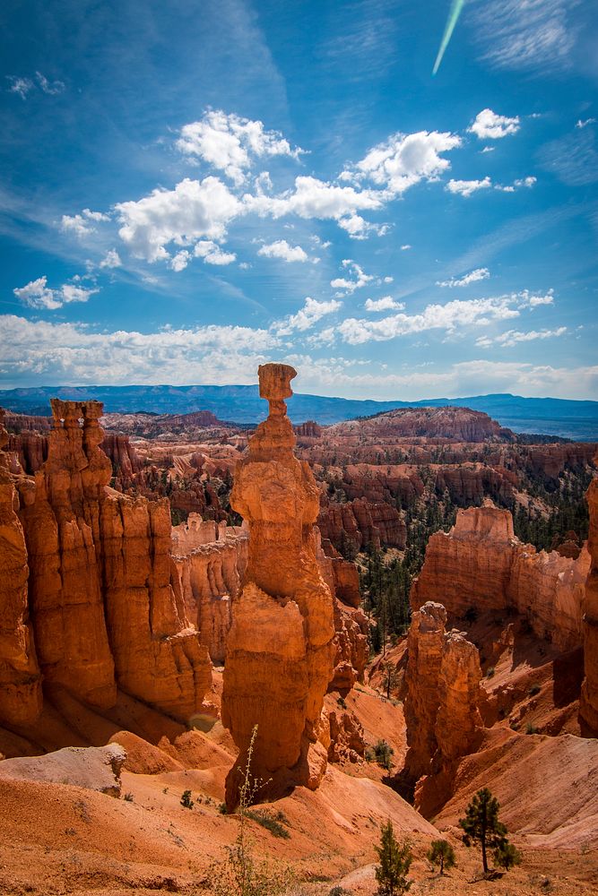 Tall red rock towers in a canyon in the Bryce Canyon National Park. Original public domain image from Wikimedia Commons