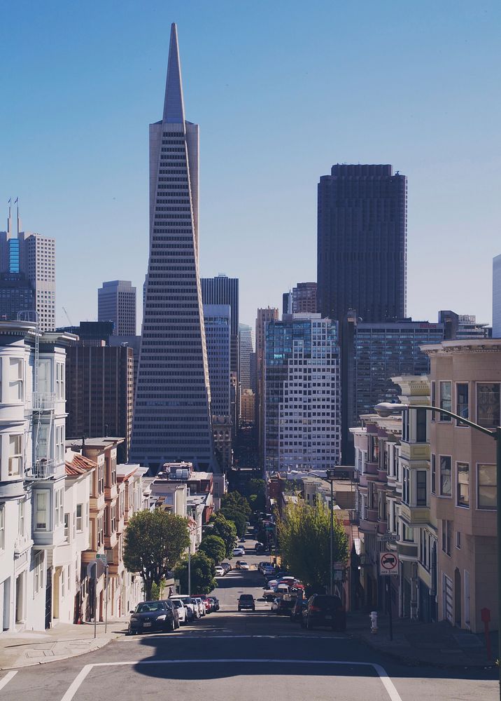 View down a street in downtown San Francisco near the Transamerica Pyramid skyscraper. Original public domain image from…