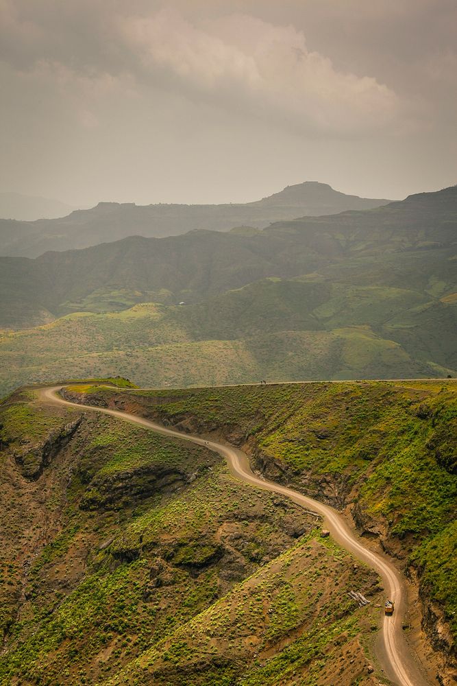 A narrow road along a lush mountain slope in Ethiopia. Original public domain image from Wikimedia Commons