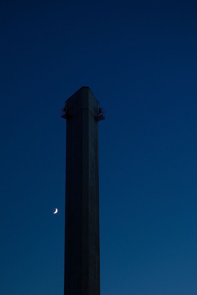 Crescent moon over a tower at Geneva. Original public domain image from Wikimedia Commons
