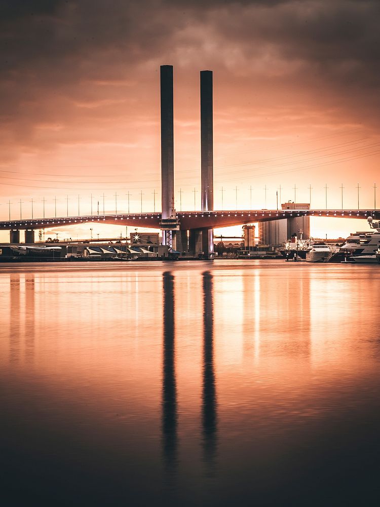 Melbourne's Bolte Bridge during a cloudy sunset with vignette effect. Original public domain image from Wikimedia Commons