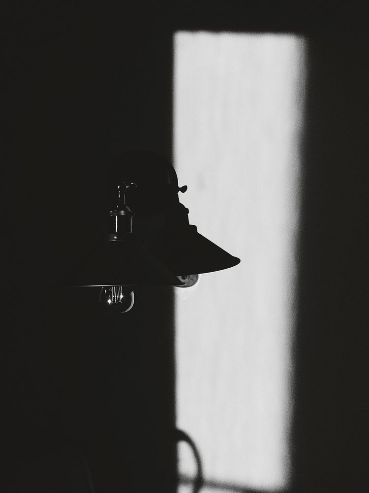 Black and white shot of vintage light lamp with shadow, Schaumburg, Illinois, United States. Original public domain image…