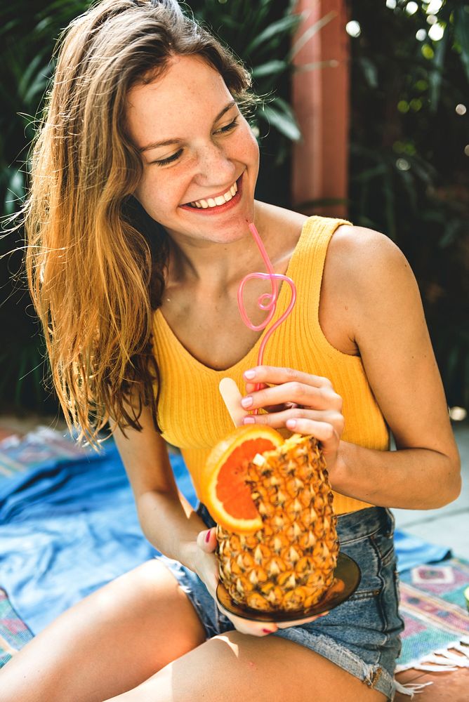Young woman with a tropical pineapple