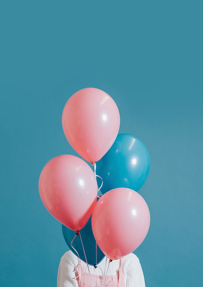 Woman with pink and blue balloons