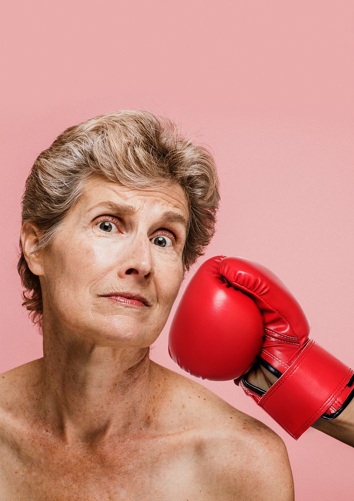 Senior woman getting punched in the face