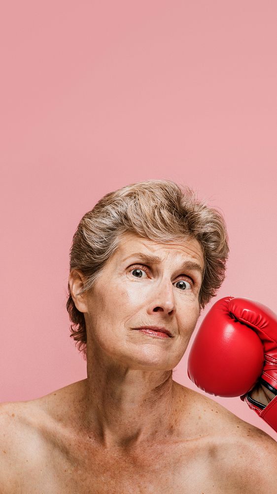 Senior woman getting punched in the face mobile phone wallpaper