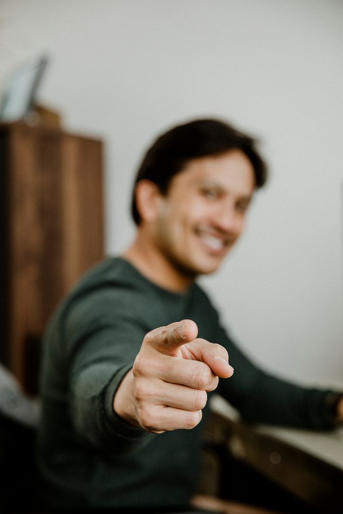 Happy man pointing at the screen