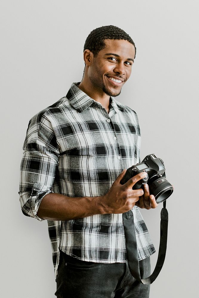 Male photographer holding a camera