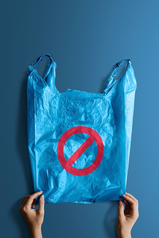 Woman holding a blue plastic bag with a ban sign