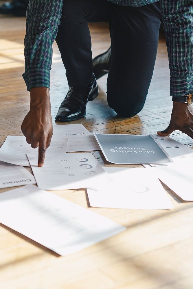Paperwork on a wooden floor
