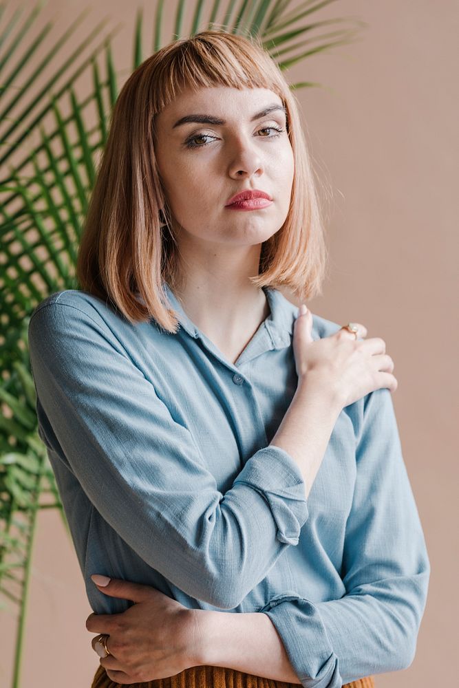 Portrait of a beautiful woman wearing a blue shirt